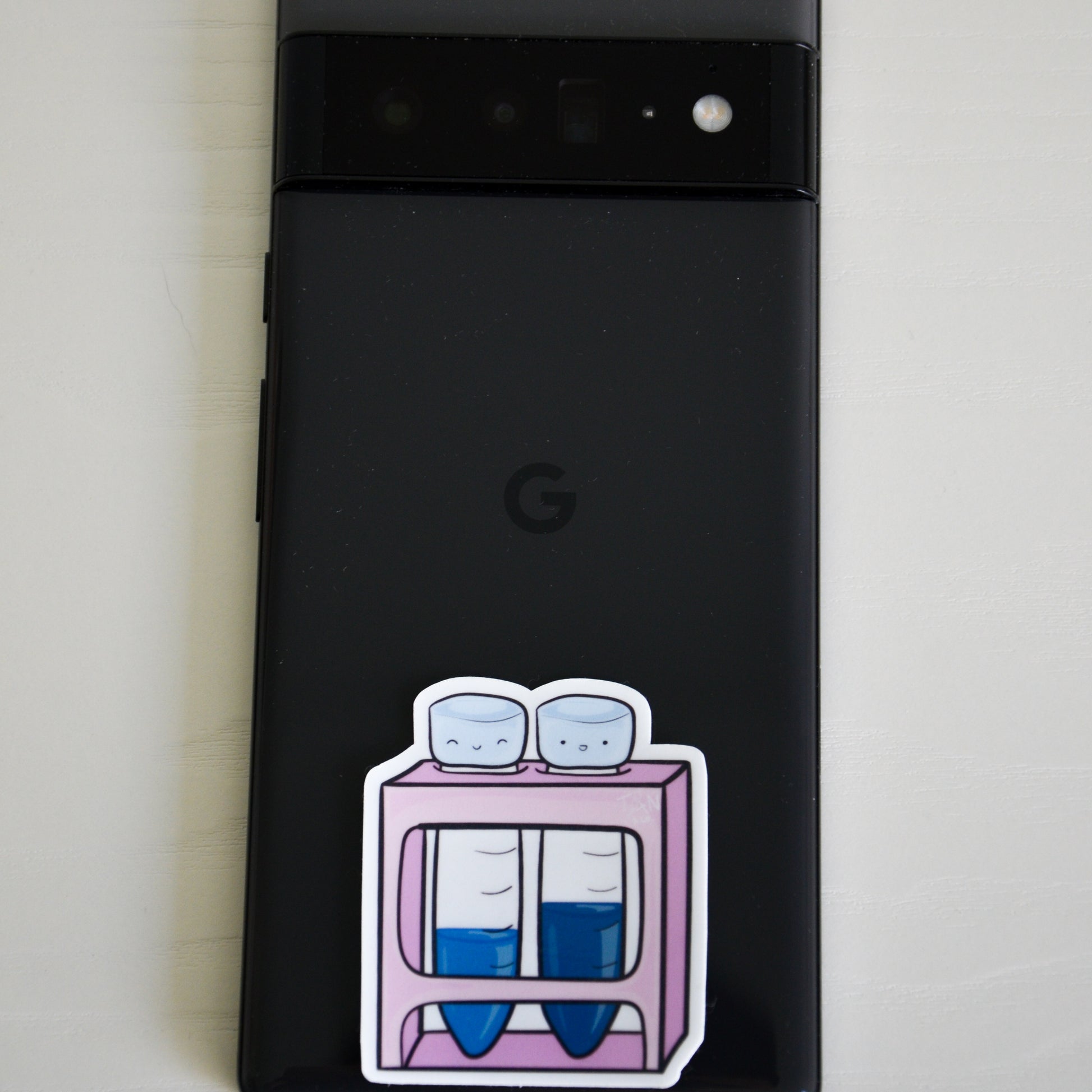 Pink falcon tubes sticker on phone